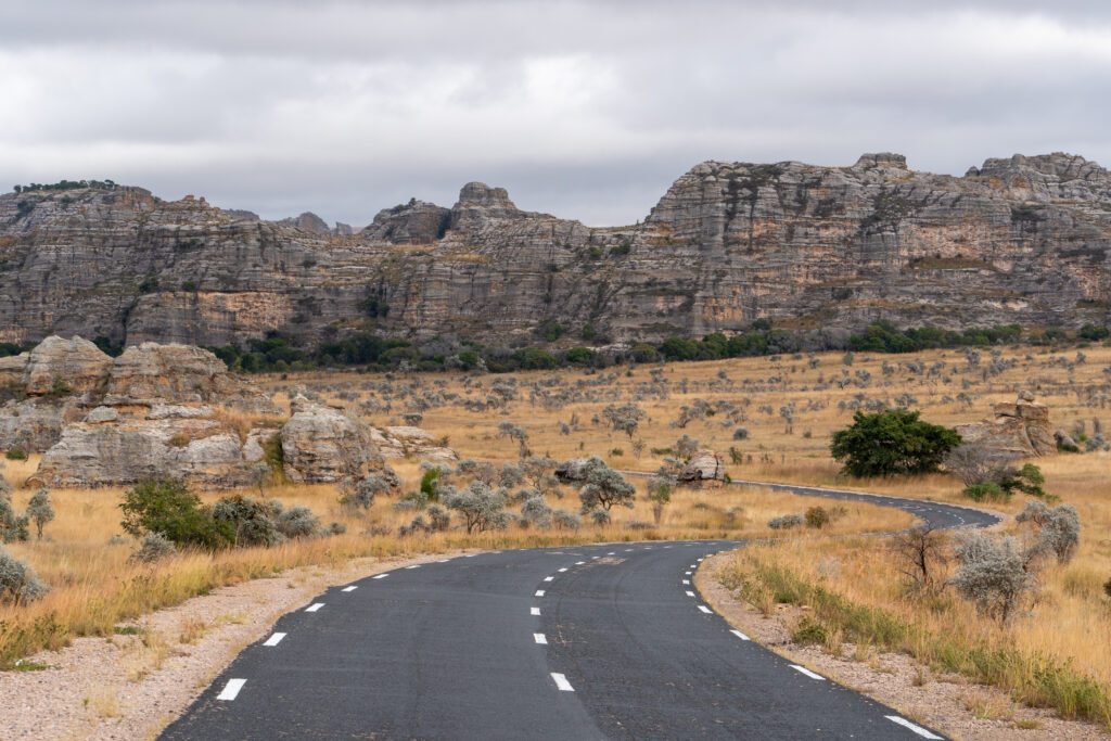 Discover Madagascar – Rocky southern landscape with dry yellow grass and a quiet, overcast sky Rocky landscape in southern Madagascar with dry yellow grass
